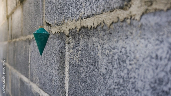 Fototapeta plumb using a right angle measurement