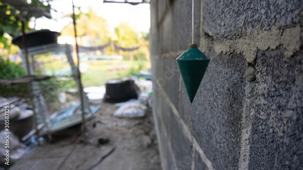 Fototapeta plumb using a right angle measurement