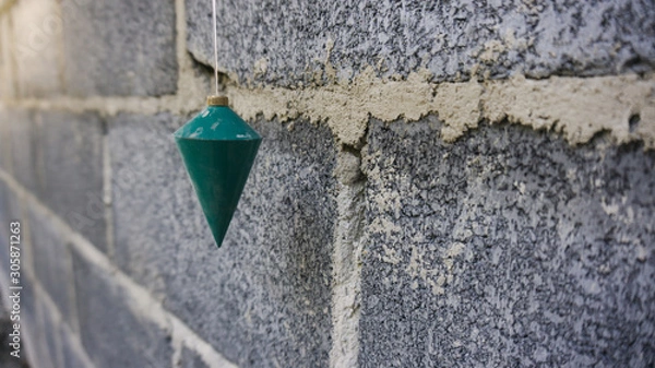 Fototapeta construction of a plumb using a right angle measurement