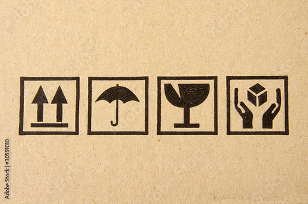 Obraz Image close-up of grunge black fragile symbol on cardboard