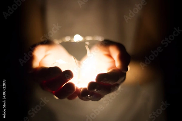 Obraz Hand holding light bulb