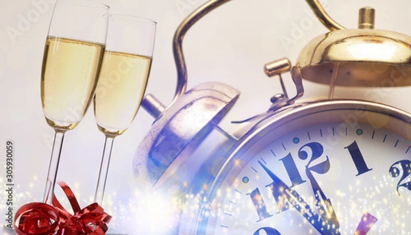 Fototapeta New Years concept with two glasses of sparkling wine