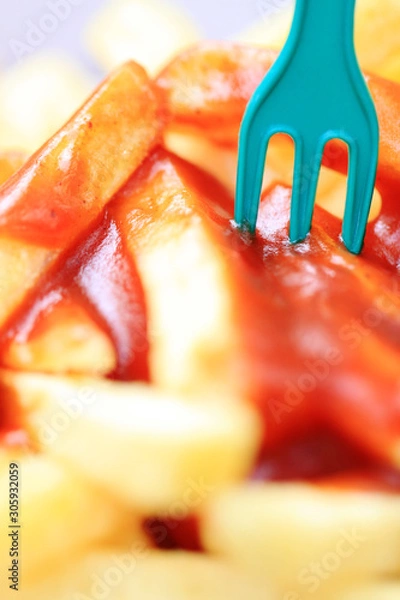 Fototapeta fries with ketchup and fork