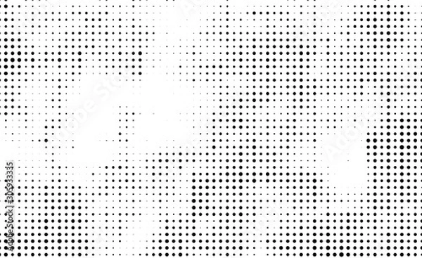 Fototapeta The texture of halftone. Abstract background of black dots on white