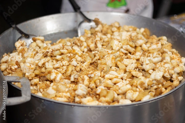 Obraz Stir fried squid eggs on flat pan.