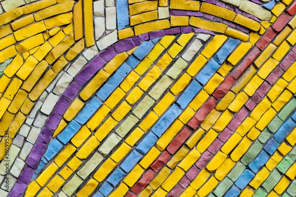 Fototapeta texture of multi-colored stones. Background from vintage mosaic on the wall.