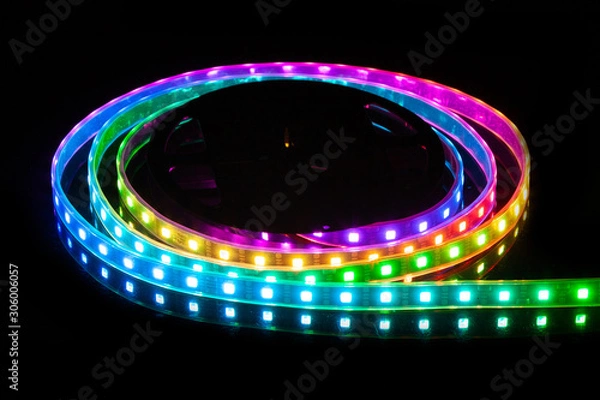 Obraz RGB LED strip on reel with black background.