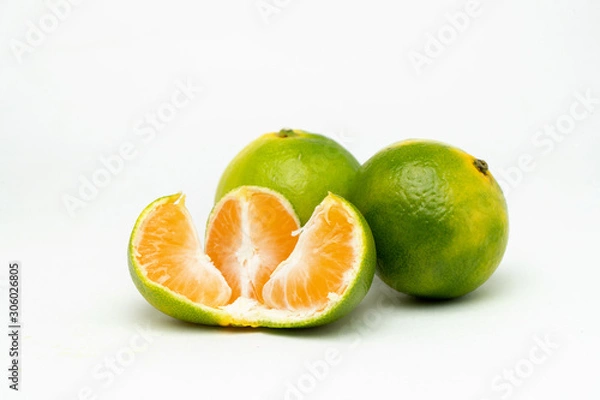 Obraz opened green tangerine on the table