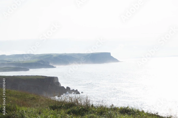 Fototapeta Majestic cliffs and coastline in morning