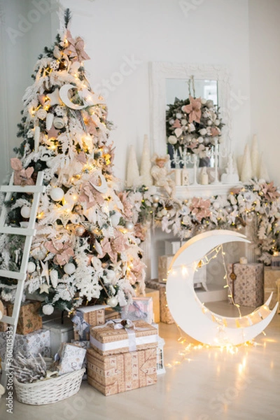 Fototapeta Close up a Christmas tree lights glittering at night. New Year fir tree with decorations and illumination. Xmas tree decorations background. Many large golden balls on fir tree New Year and Christmas