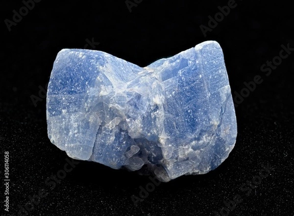 Obraz Light blue calcite mineral rough stone isolated on black background