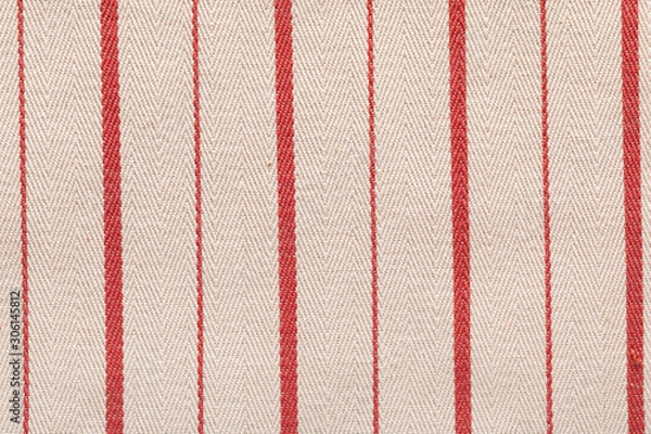 Fototapeta Red fabric pattern striped texture. Colored striped coarse linen fabric closeup as background.