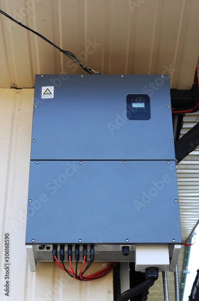 Obraz Solar inverter  on the side of a house