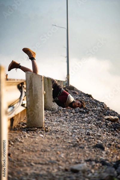Obraz falling man on the rocky road for insurance travel adviser