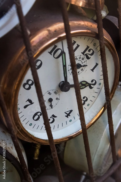 Obraz Old school retro vintage alarm clocks tracking time trapped in a bird cage rusty metal iron nice soft shadows slow dying feeling vibe historical objects hidden clock Prison locked away Chernobyl