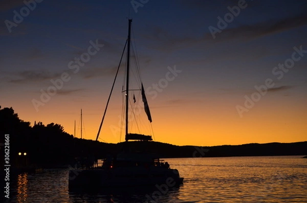 Fototapeta sailing at sunset
