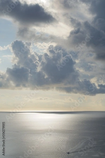 Fototapeta 夕日に光る海と雲