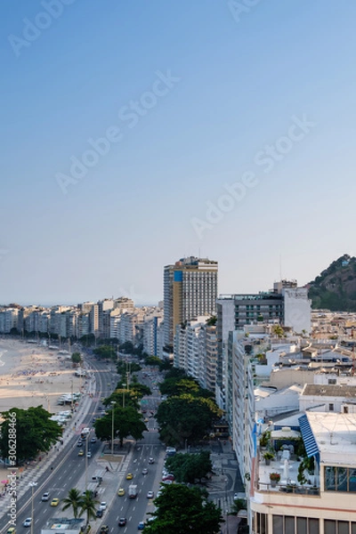 Obraz view of Copacabana beach right side during late afternoon, taken from the rooftop of a hotel, some shadows can be seen on the beach. Rio de Janeiro, Brazil
