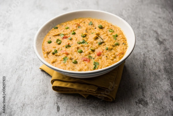 Obraz Vegetable masala oats khichadi served in a bowl. selective focus