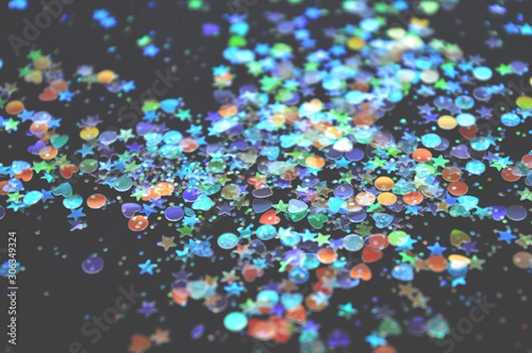 Fototapeta Blurry colorful glitter in vintage colors on black background, shiny confetti, kamifubiki nail art