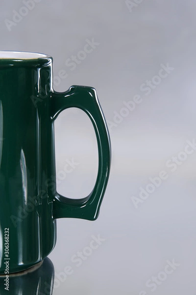 Obraz Empty mug saying different languages on isolated ground-