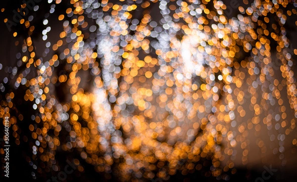 Obraz Golden bokeh mixed with diffused white light from the winter Christmas tree in Thailand. Business theoretical concepts for product background use.