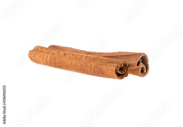 Fototapeta two cinnamon sticks on a white background isolated