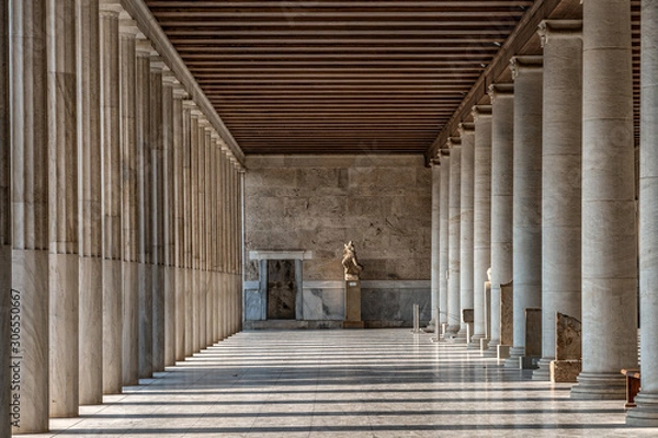 Fototapeta Passage with marble ionic columns inside stoa of Attalos, ancient agora of Athens before sunset