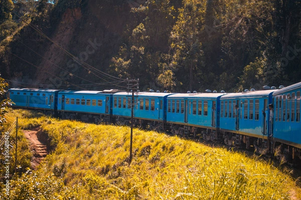Fototapeta Blue train on railway in Sri Lanka