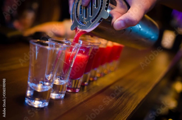Fototapeta Set of red shots on bar counter