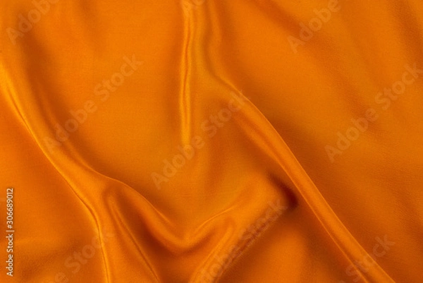 Fototapeta Golden silk or satin luxury fabric texture can use as abstract background.