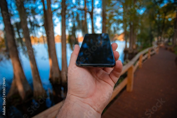 Obraz man with phone in hand 