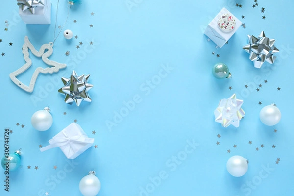 Fototapeta Christmas background with decorations and gift boxes on blue background