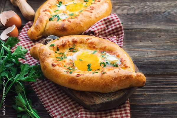 Fototapeta Khachapuri Ajarian on rustic wooden background