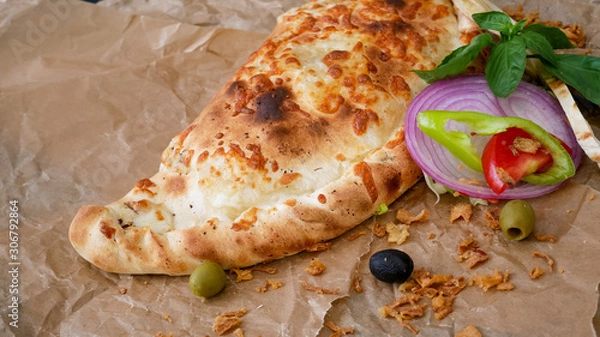 Obraz Calzone on a restaurant table
