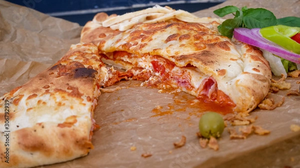 Obraz Calzone on a restaurant table