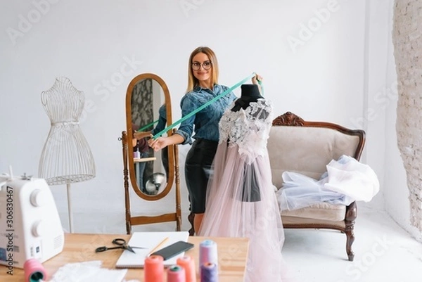 Fototapeta Fashion designer working in the studio