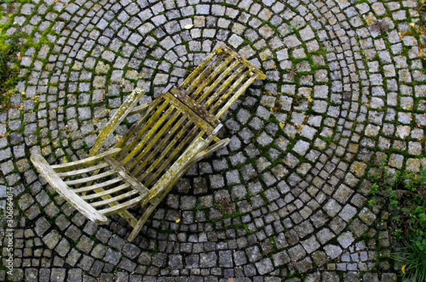Obraz Deckchair with patina moos and lichen on a stone circle