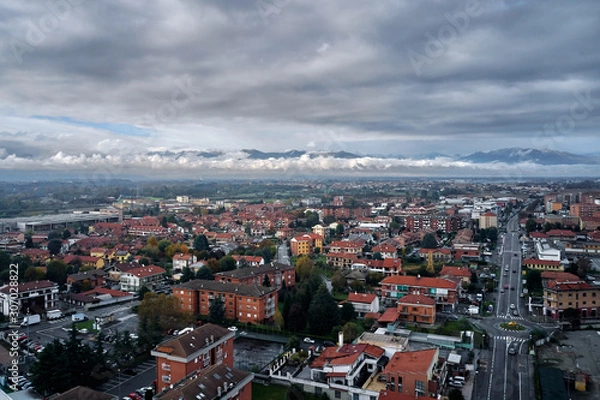 Fototapeta aerial view of torino Turin in autumn with the mountains and clouds at the horizon