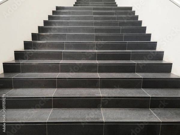 Obraz Staircase with black marble stone stairs viewed in perspective. Abstract modern architecture or interior photo in minimalism style.