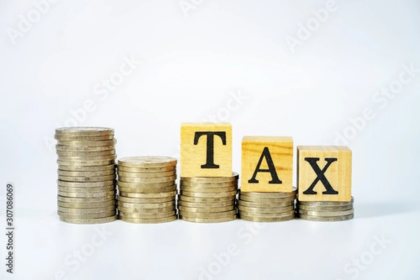 Fototapeta Business concept of tax on investment on white background, Stack coins and text box.