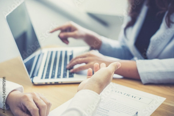 Fototapeta Business people negotiate for customers to sign land sales contracts, Property purchase contract of concept..