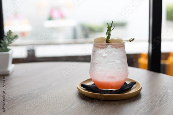Fototapeta Lychee Soda on Cafe Table