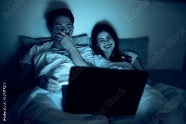 Fototapeta man and woman using tablet computer at home