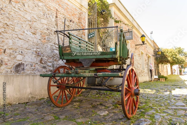 Obraz Horse carriage in the Street of Sighs, in the historic center, a World Heritage Site by Unesco in 1995. The houses are from the 18th century. Uruguayan city of Colonia del Sacramento