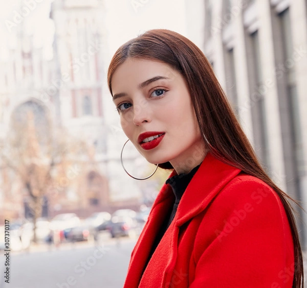 Obraz A stunning and unsurpassed lady with charming look leaned a little and looks into the frame