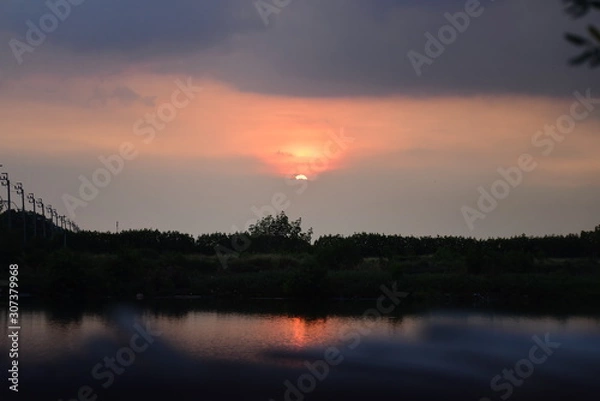 Fototapeta sunset over lake