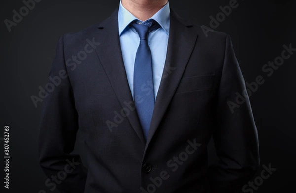 Obraz Man in black blue suit with tie