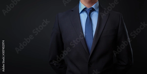 Obraz Man in black blue suit with tie
