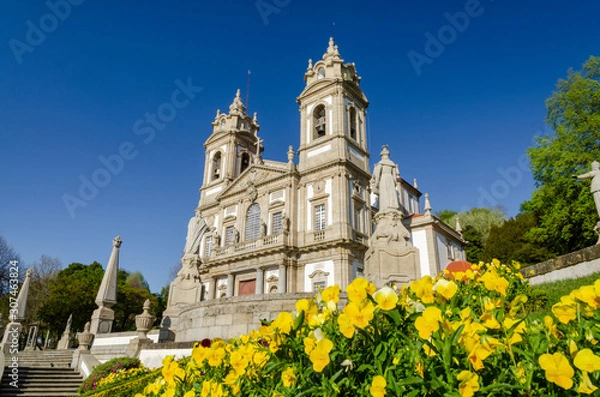 Obraz Sanctuary of Bom Jesus do Monte with a yellow flowers under a blue sky